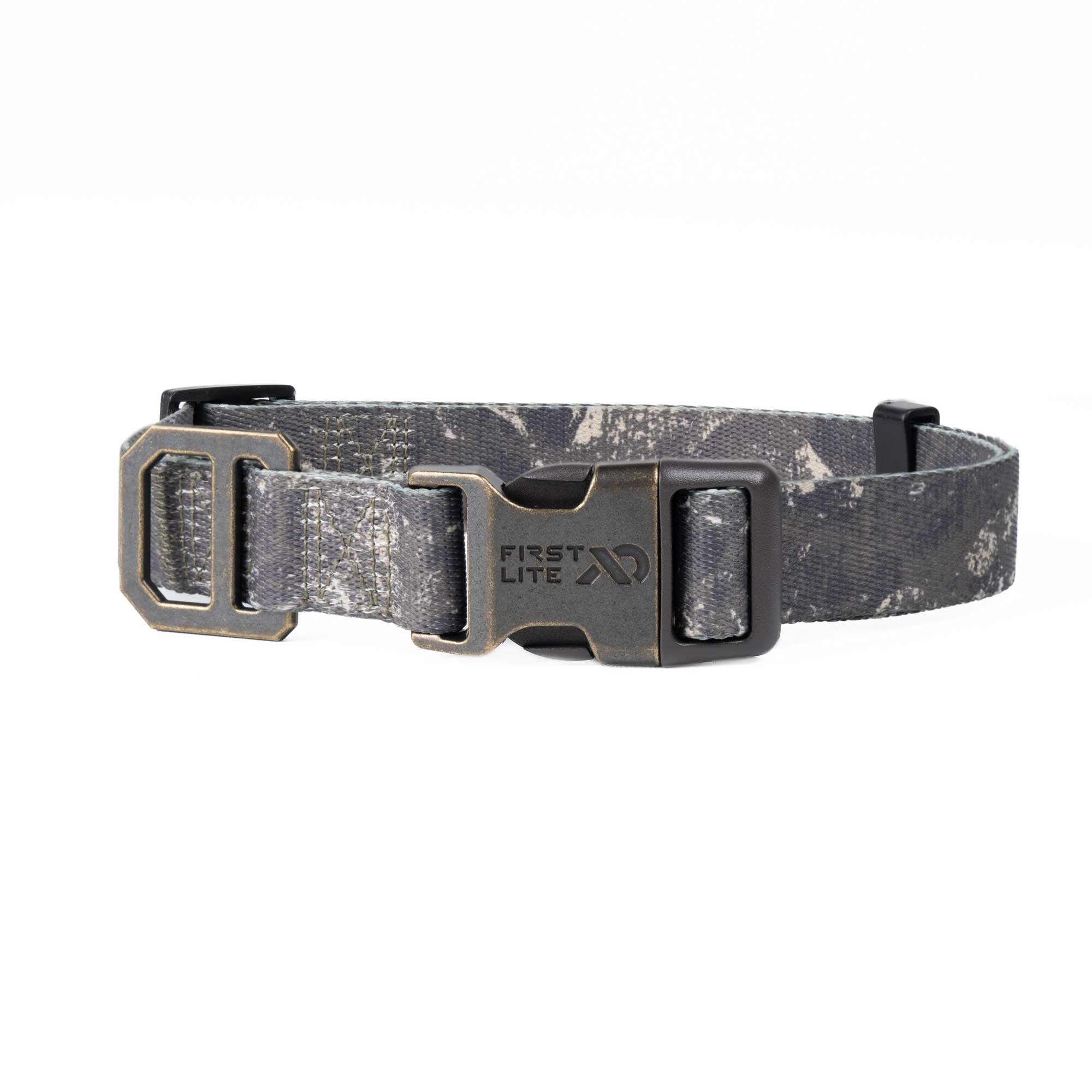 A First Lite dog collar with a gray and black camouflage pattern, featuring a dark metal quick-release buckle and matching metal D-rings, shown against a plain white background.