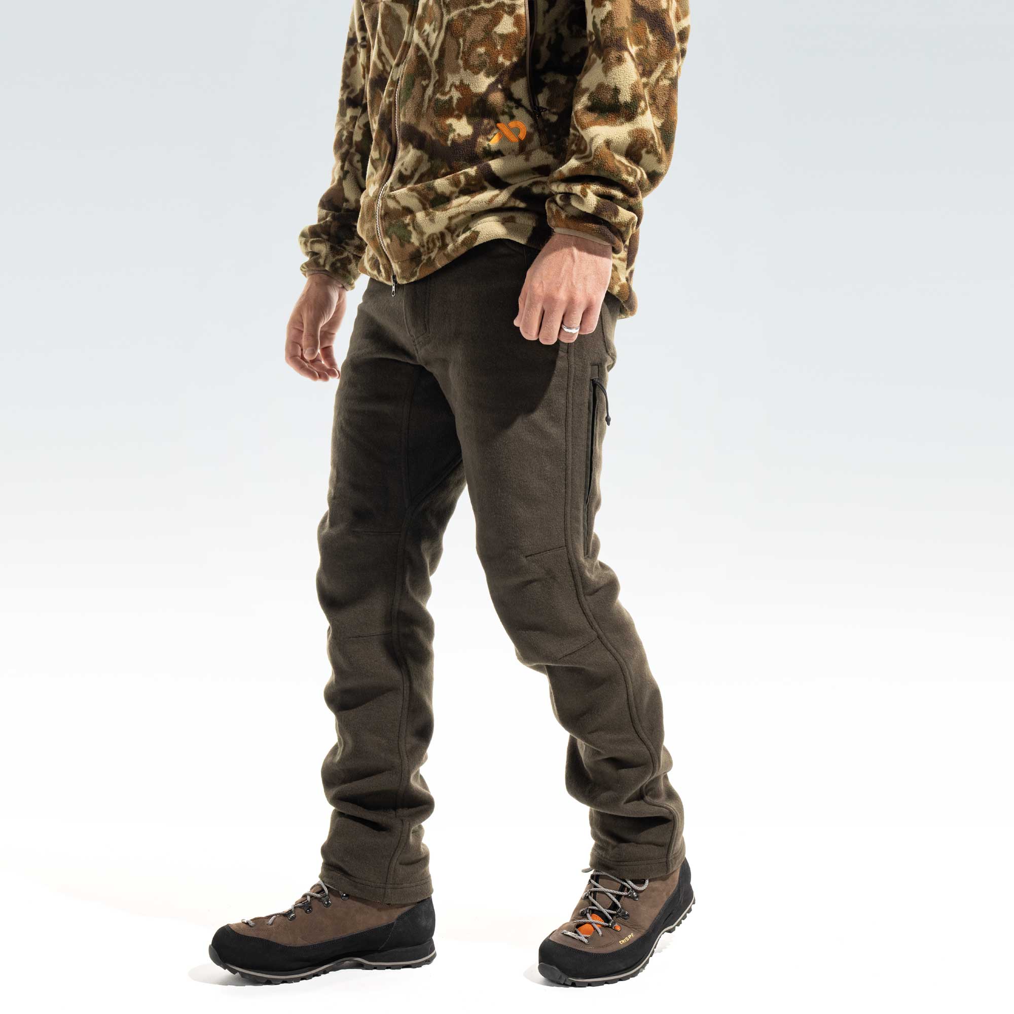 Man wearing dark moss pants and brown boots.
