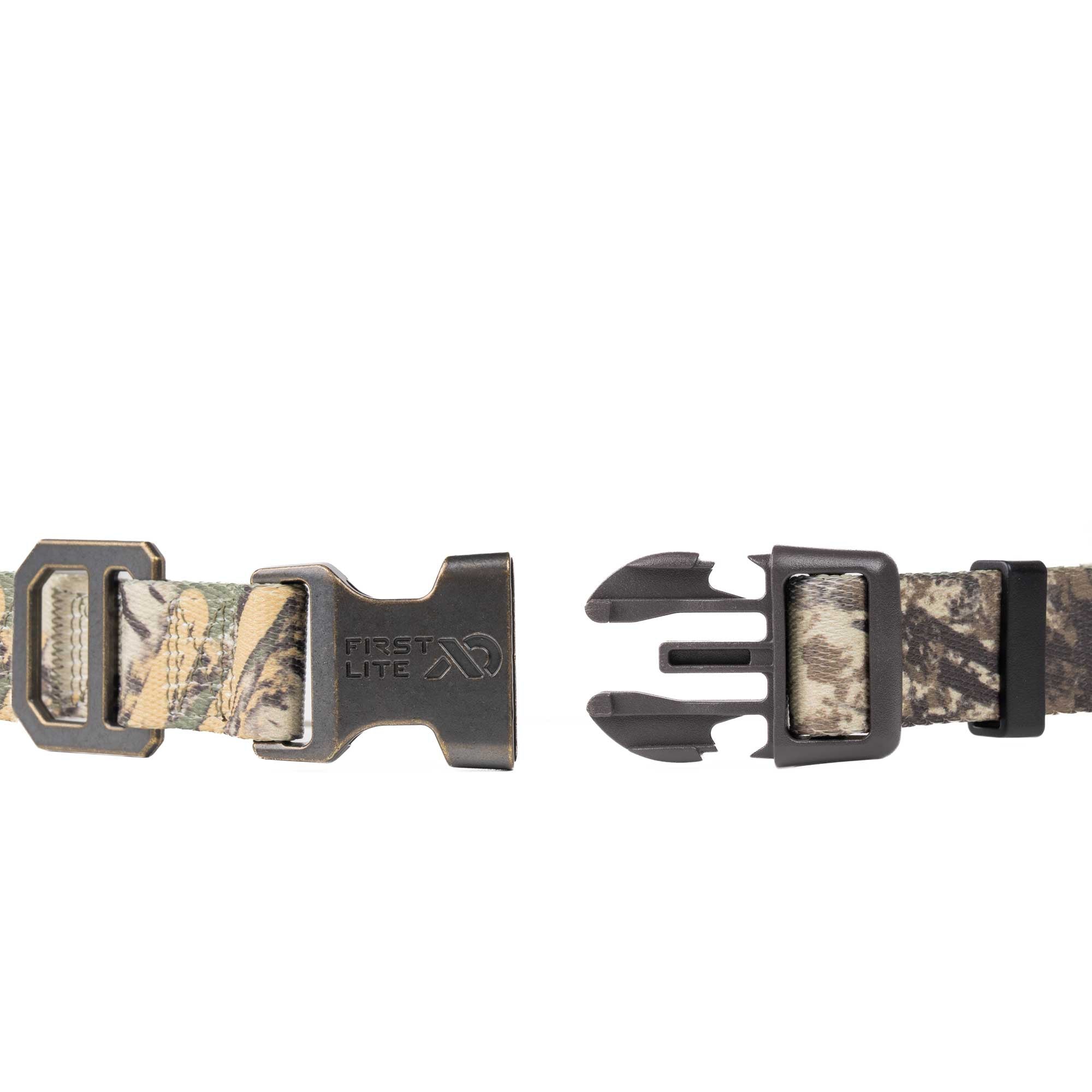 A close-up of a camouflage-patterned strap with black buckles, shown in a disassembled state on a plain white background.