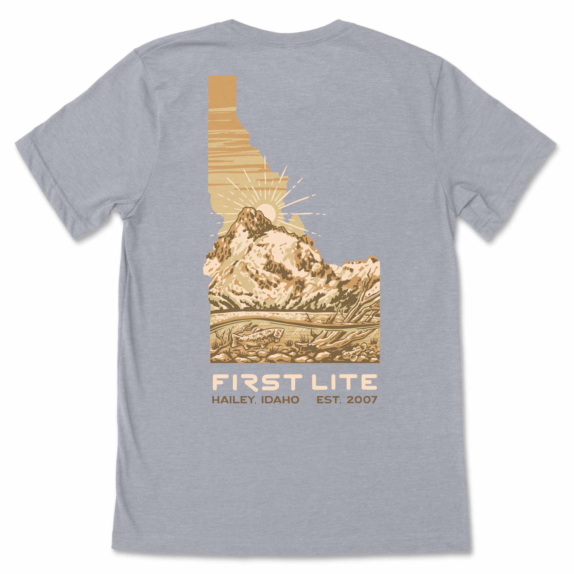 Gray t-shirt with an Idaho mountain graphic and 'First Lite' branding on a white background